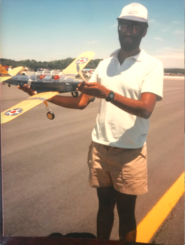 young Vance holding model plane